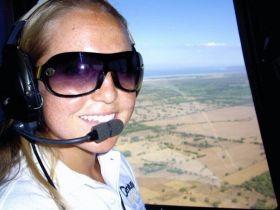 Kristin Wilson, relocation specialist in helicopter searching for properties in Nicaragua – Best Places In The World To Retire – International Living